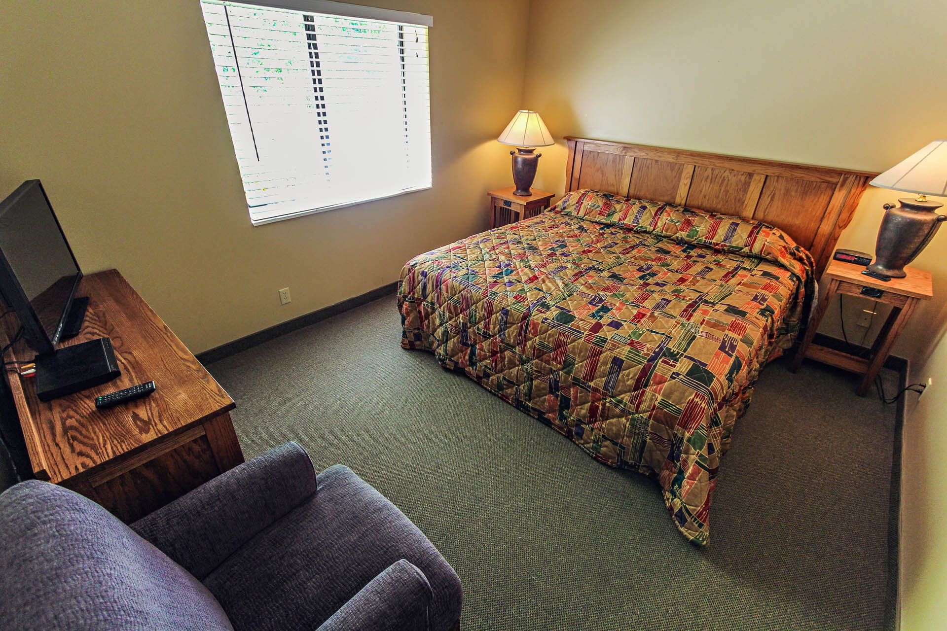 A cozy master bedroom at VRI's Powder Ridge Village in Eden, Utah.